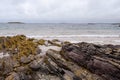 Rough coarse stone coastline and powerful ocean wave. West coast of Ireland. Irish nature landscape. Connemara area Royalty Free Stock Photo