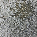 Rough concrete surface displaying irregular patterns of cracks and exposed Royalty Free Stock Photo