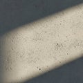 Rough concrete surface with small pits and texture variations, illuminated by angled Royalty Free Stock Photo
