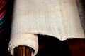 Rough cotton fabric on loom, raw material plain fabric for natural dyeing Royalty Free Stock Photo