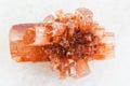 rough crystal of Aragonite stone on white marble