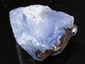 rough crystal of blue Chalcedony gemstone on dark Royalty Free Stock Photo