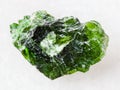 rough crystal of Chrome Diopside gemstone on white