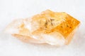Rough crystal of Citrine yellow quartz on white