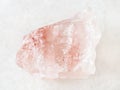 rough crystal of rose quartz gemstone on white Royalty Free Stock Photo