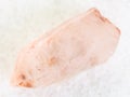 rough crystal of rose quartz gemstone on white Royalty Free Stock Photo