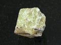 rough crystal of Saamite (fluorapatite) on dark