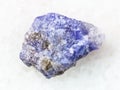 rough crystal of Tanzanite stone on white