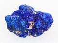 rough crystalline Azurite stone on white marble