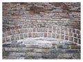 Rough hewn chiseled red brick wall for abstract, textured background.