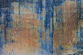 rough dark-blue sun faded flat vertical sheet metal surface with thin rust Royalty Free Stock Photo