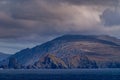 Rough and desolate islands under cloudscape, Cape Horn, Chile Royalty Free Stock Photo