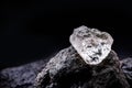 Rough diamond  precious stone in mines. Concept of mining and extraction of rare ores Royalty Free Stock Photo