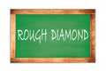 ROUGH DIAMOND text written on green school board