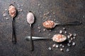 Rough and fine pink Himalayan sea salt on vintage spoons