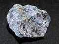 rough galena stone with chalcopyrite vein on dark