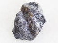 rough galena stone with chalcopyrite vein on white