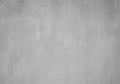 Rough gray concrete wall with a textured surface. The wall exhibits a slightly uneven pattern with Royalty Free Stock Photo