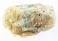 rough green beryl (chrysoberyl) stone on white