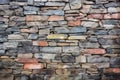 rough hewn, multi-colored stone wall