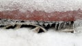 Rough icy texture with small icicles on red metal surface background Royalty Free Stock Photo