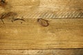 Rough knotty wood plank backdrop close up