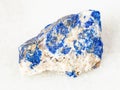 rough Lazurite (Lapis Lazuli) stone on white Royalty Free Stock Photo