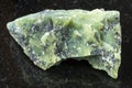 rough Lizardite stone on dark background Royalty Free Stock Photo