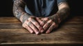 Rough male hands with tattoos and dirty fingernails on a rough wooden table. Generative AI Royalty Free Stock Photo