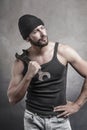 Rough man holding a wrench on his shoulder Royalty Free Stock Photo