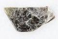 Rough muscovite common mica on white marble Royalty Free Stock Photo