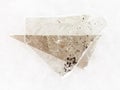 rough muscovite mica lamina on white marble Royalty Free Stock Photo