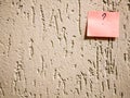 Rough plaster background with a sticker Royalty Free Stock Photo