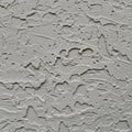 Rough plaster wall surface with a complex pattern of irregular indentations and Royalty Free Stock Photo