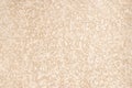 Rough plastered surface. Beige peach abstract background with heterogeneous texture