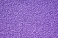 Rough purple bulge concrete wall background, texture