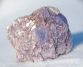 Rough Purple Lepidolite cluster from Brazil on white snow. Lepidolite Mica Slices.