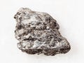 rough quartz-biotite schist stone on white