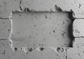 A rough, rectangular hole is evident in a concrete surface. The Royalty Free Stock Photo