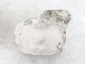 rough rock-crystal of quartz gemstone on white