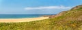 Rough rocky coastal panoramic landscape of Brittany with blue sky. Royalty Free Stock Photo