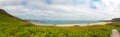Rough rocky coastal panoramic landscape of Brittany with cloudy sky. Royalty Free Stock Photo