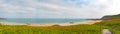 Rough rocky coastal panoramic landscape of Brittany with cloudy sky. Royalty Free Stock Photo