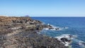 Rough and rocky landscape of the coastal walking path from Montana Amarilla to Amarilla Golf and Golf Del Sur, Tenerife, Spain Royalty Free Stock Photo