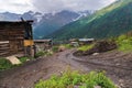 A rough rural road in the Caucasian mountain village Royalty Free Stock Photo