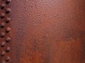 rough rusted red brown steel plate with riveted panel and textured surface Royalty Free Stock Photo