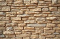 Rough sandstone block wall surface with visible mortar lines. Natural material creates weathered facade, provides neutral Royalty Free Stock Photo