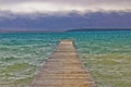 Rough sea and foggy mountain wooden boardwalk Royalty Free Stock Photo