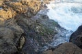 arraial of cabo Rough sea with hangover strong winds and waves crashing on rocks Royalty Free Stock Photo