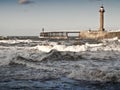 Rough sea with pier in whitby Royalty Free Stock Photo